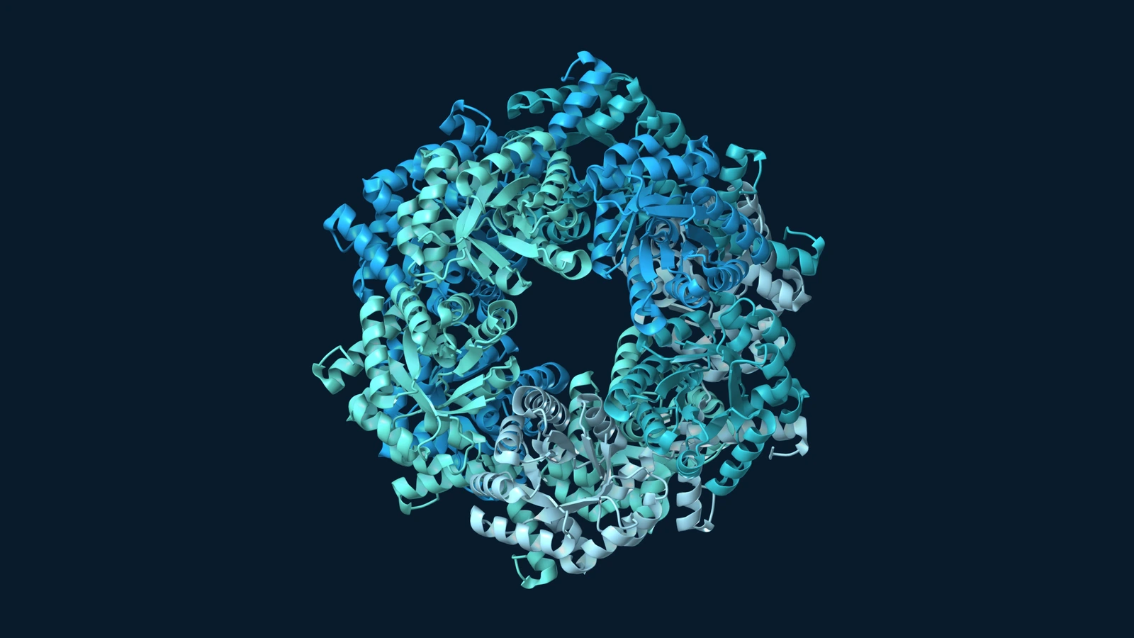 Ten subunits of E. coli fructose-6-phosphate aldolase form a ring-shaped assembly, shown as blue and teal ribbons on a dark background.